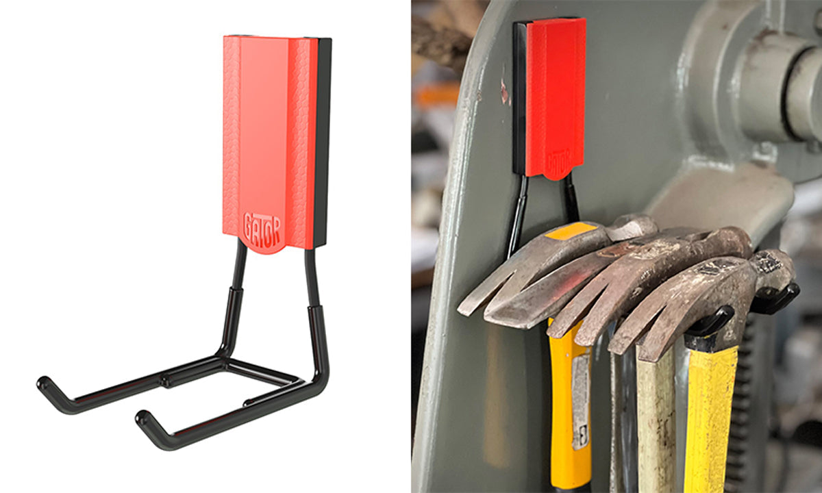 Gator heavy-duty magnetic hook holding hammers on steel workshop equipment.