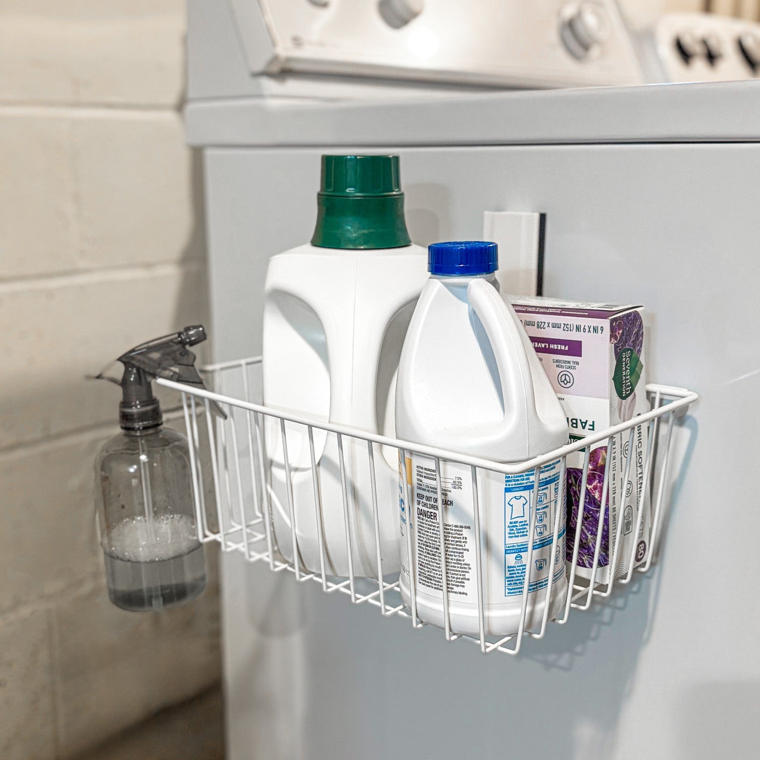 White Gator magnetic basket mounted on the steel side of a washing machine.
