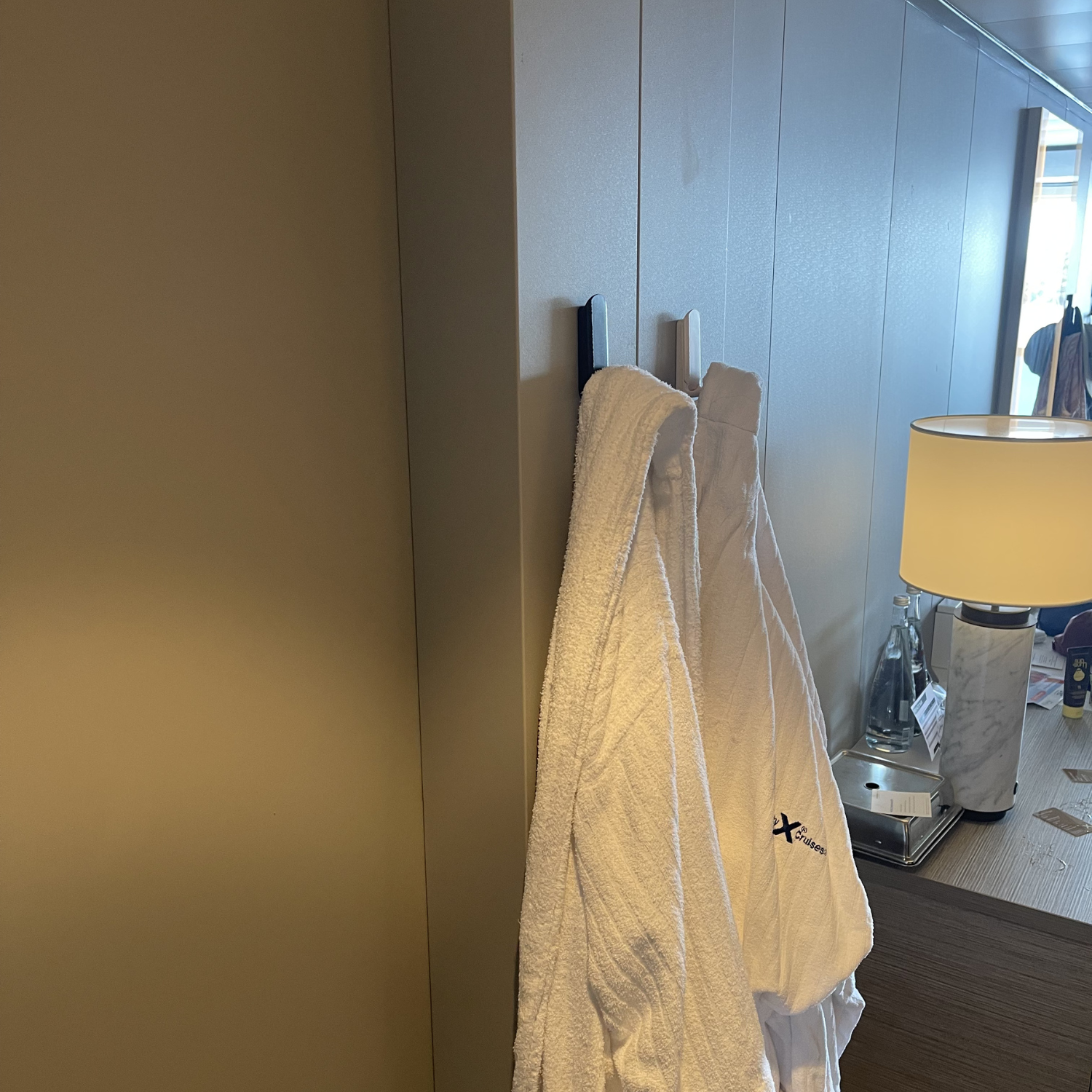 Gator Magnetics mini magnetic hooks being used in a cruise ship cabin to hang up towels and robes.