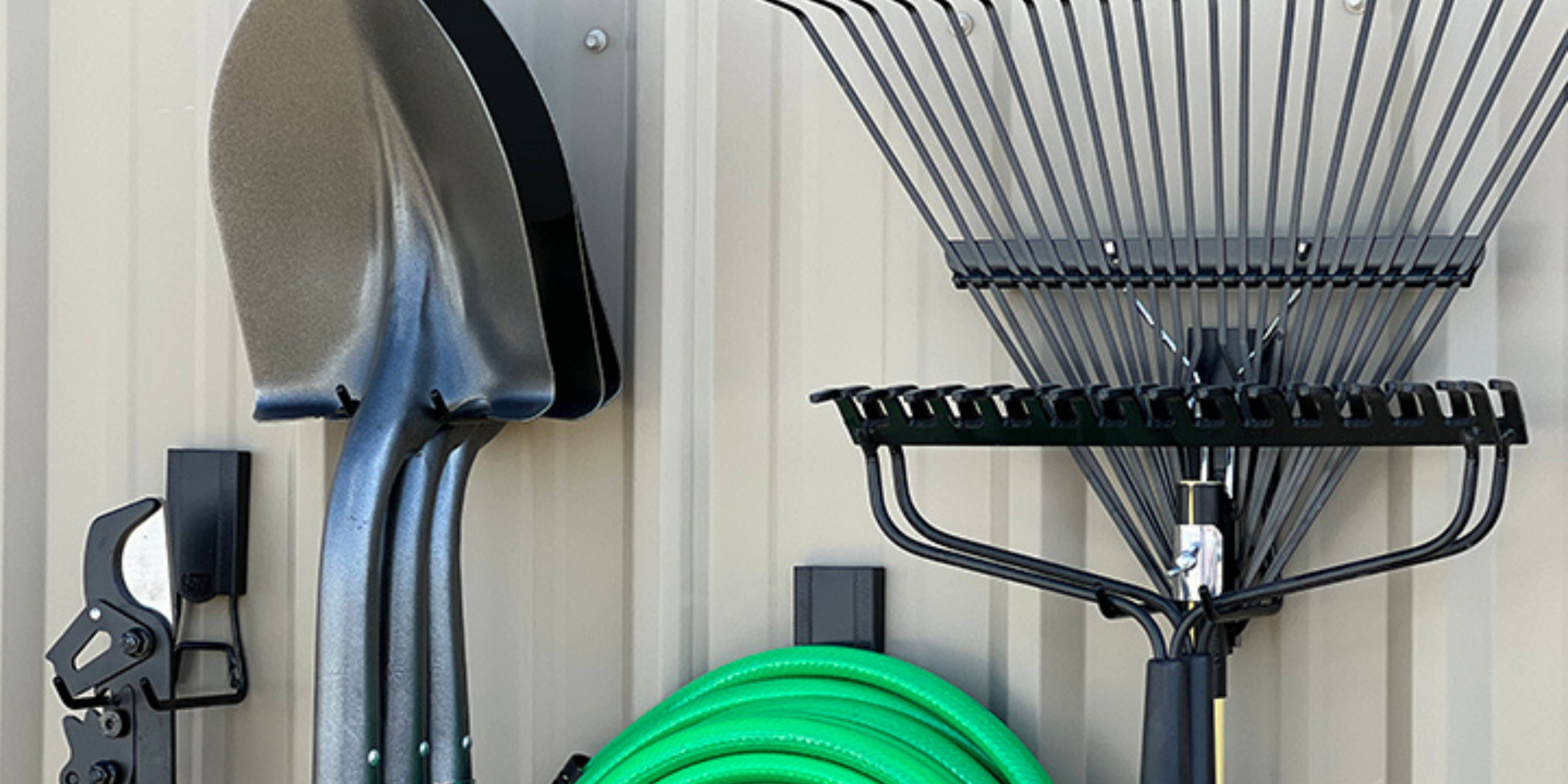 Magnetic hooks from Gator Magnetics being used on pole barn siding to allow for storage without drilling holes into the steel walls.