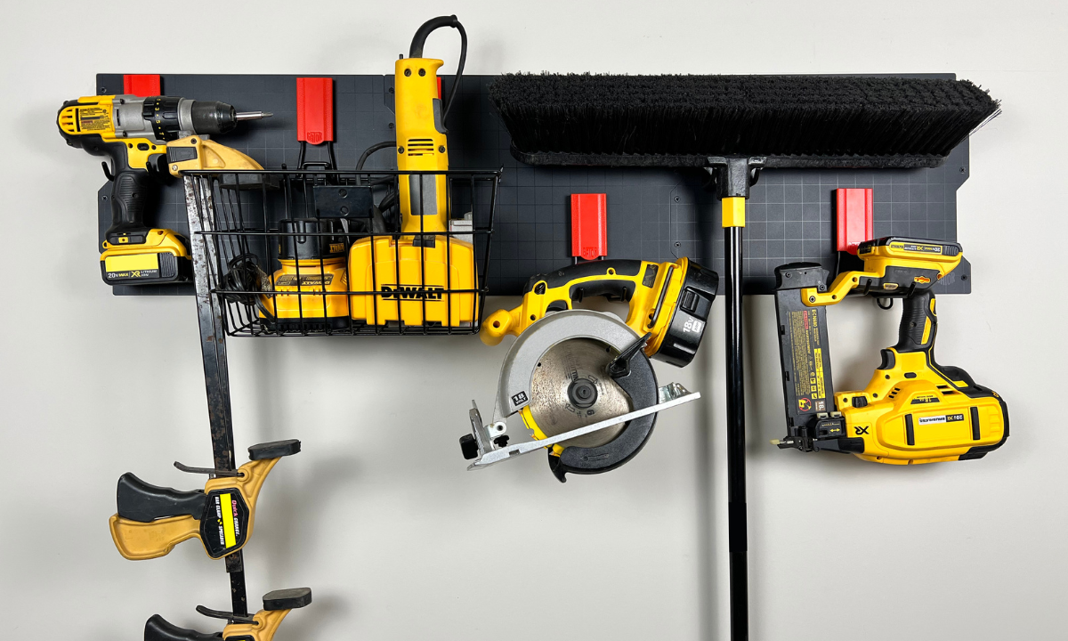 Black Gator Steel Wall Panel with magnetic hooks organizing yellow and black power tools.