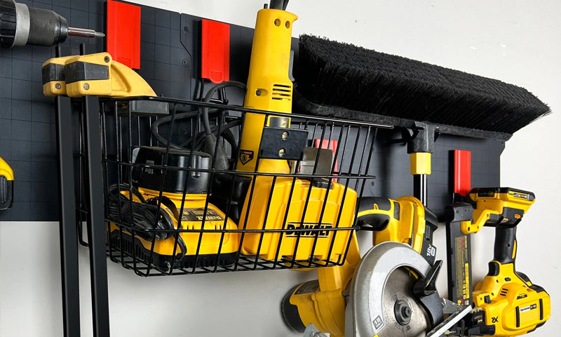 Gator Steel Wall Panel with magnetic basket and hooks organizing yellow DEWALT power tools and broom.