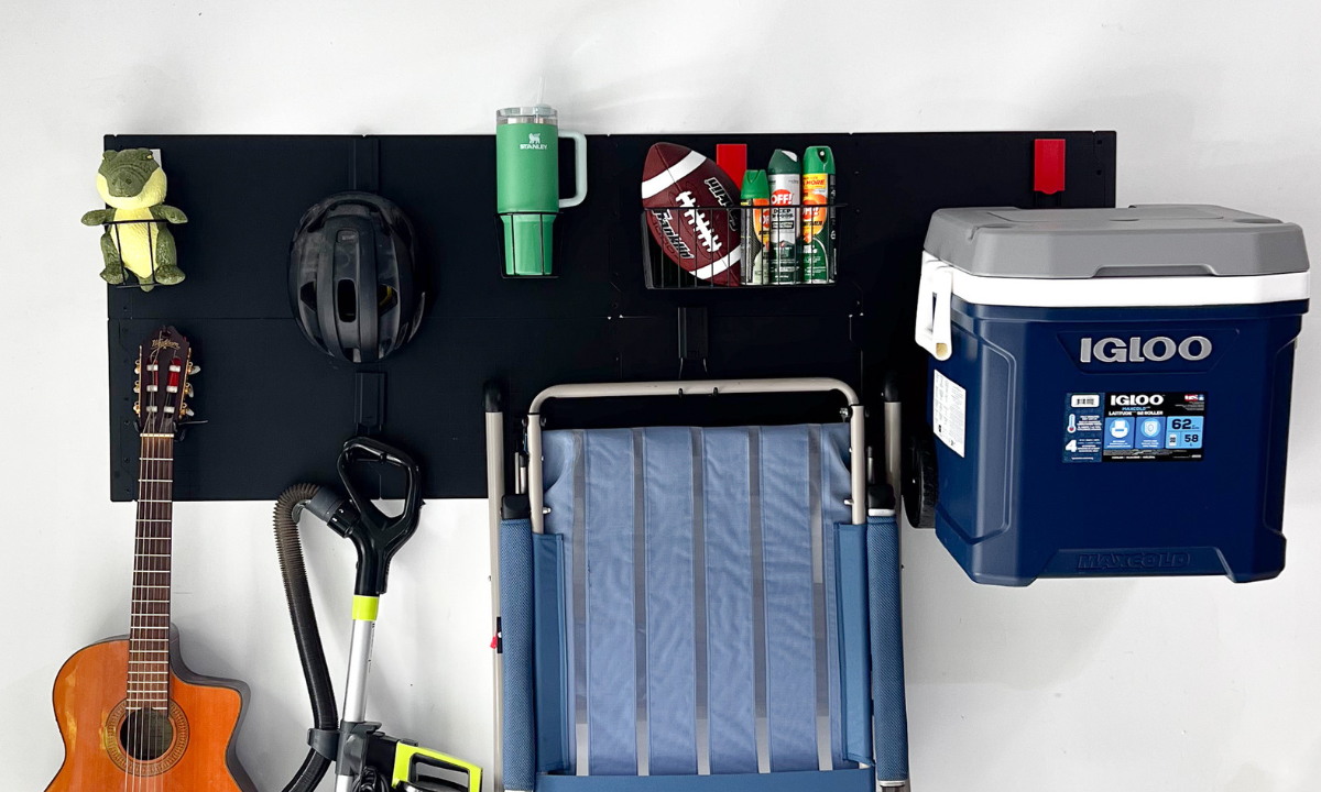 Camping chair, cooler, helmet, travel mug, guitar and string trimmer organized with Gator magnetic hooks.