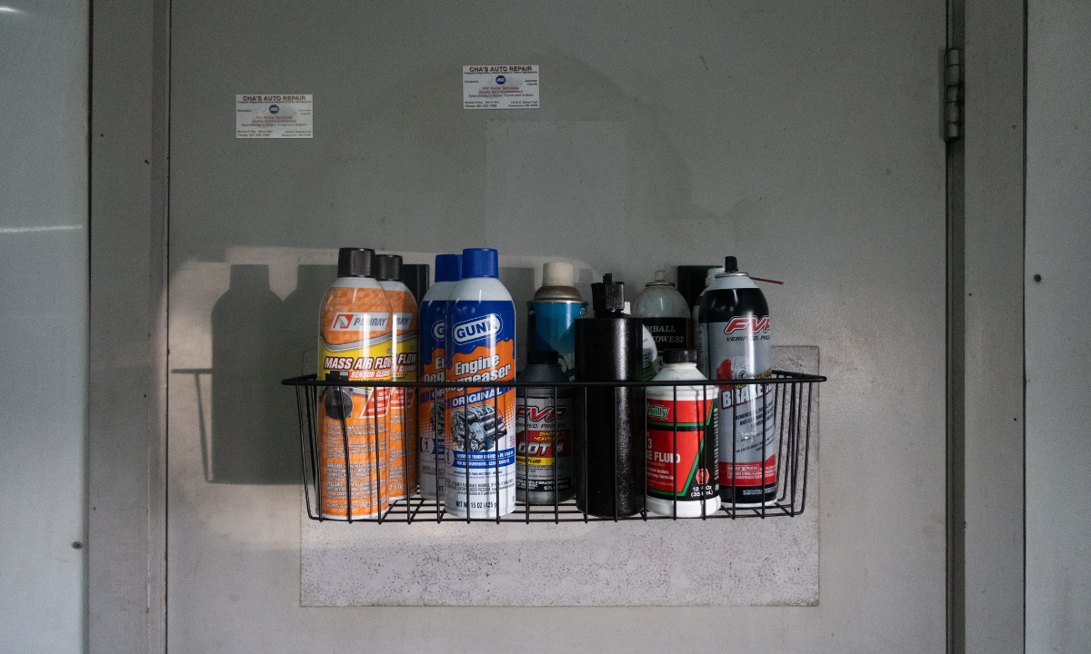 Black Gator magnetic storage basket holding engine cleaner, brake fluid and other automotive supplies.
