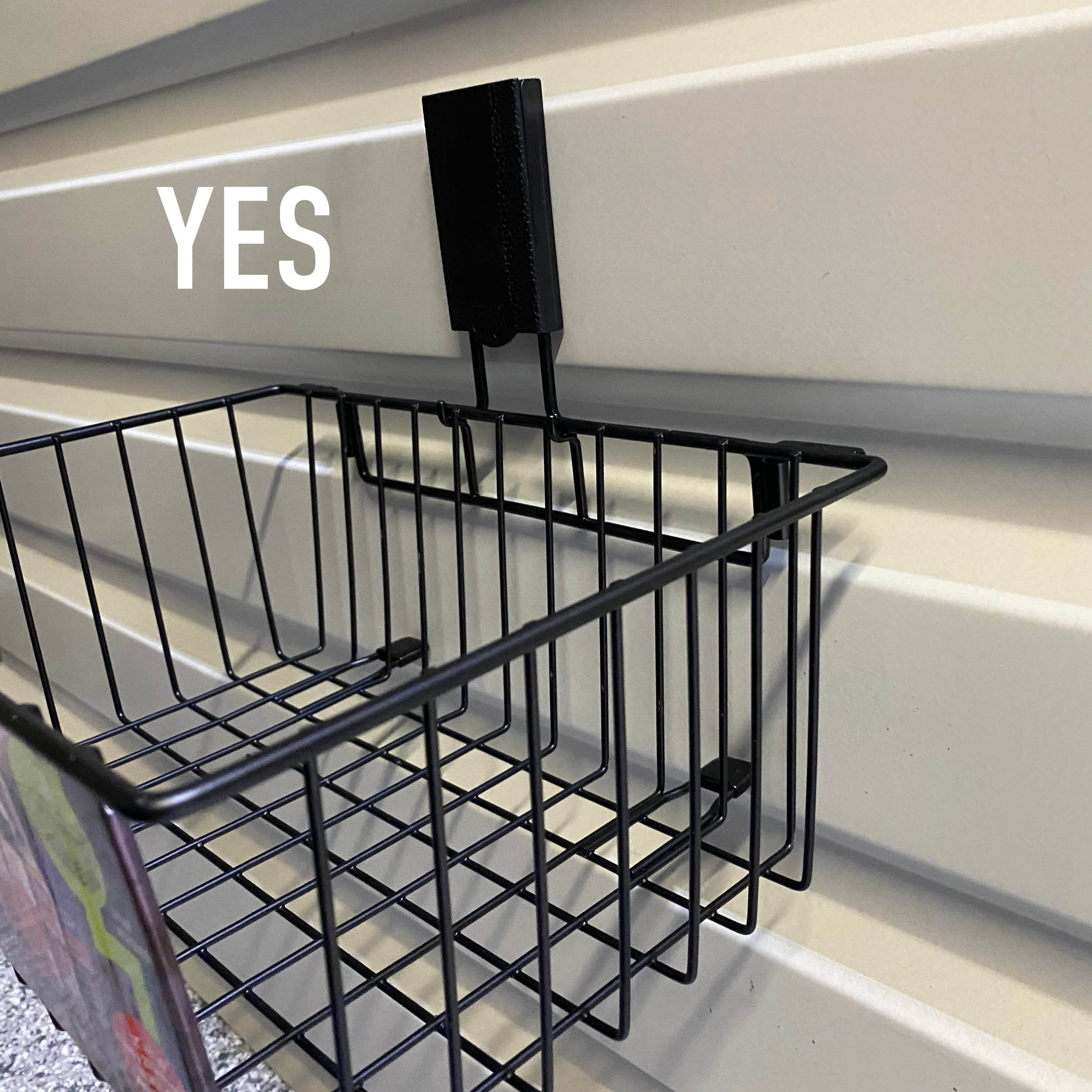 Black Gator magnetic basket mounted on a beige 16-gauge galvanized steel trailer wall.