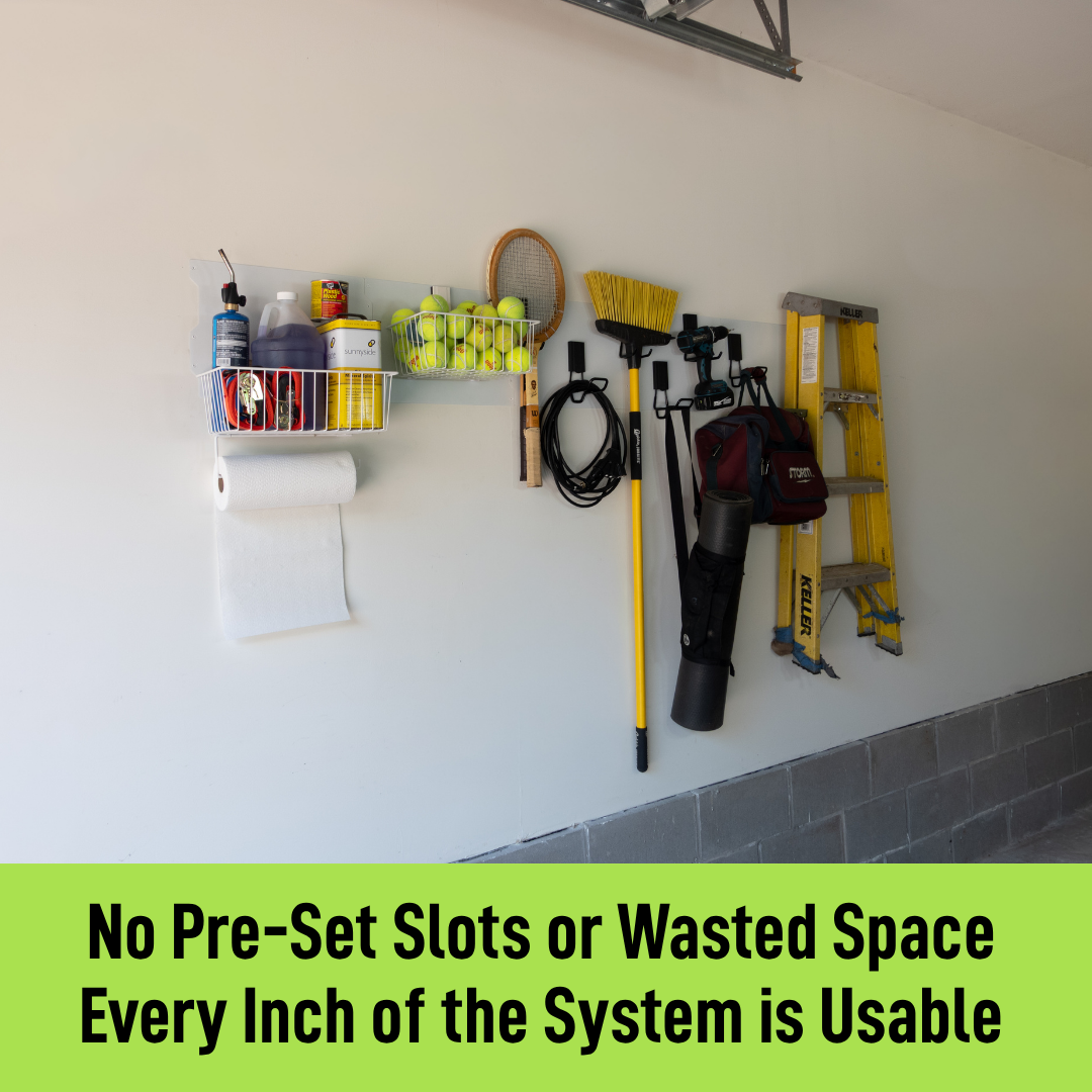 White magnetic wall storage system organizing yard tools, baskets, a ladder and sports gear.